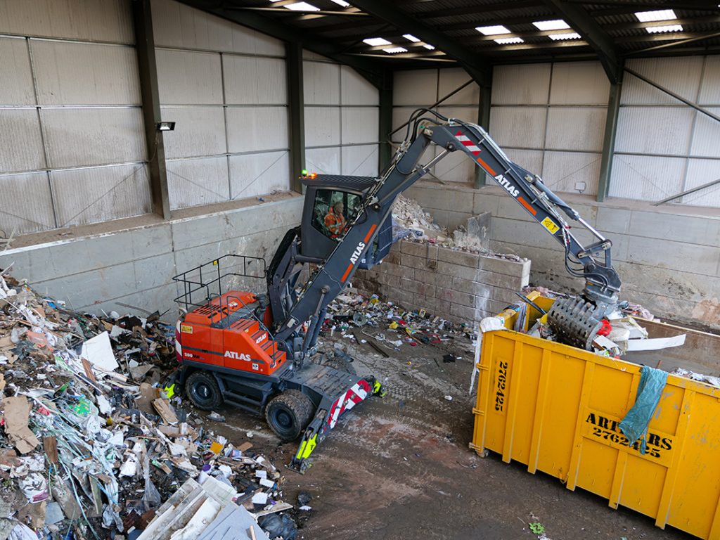 Atlas 200MH Material Handler with Selector Geab sorting Waste at Banks Skip Hire Ltd