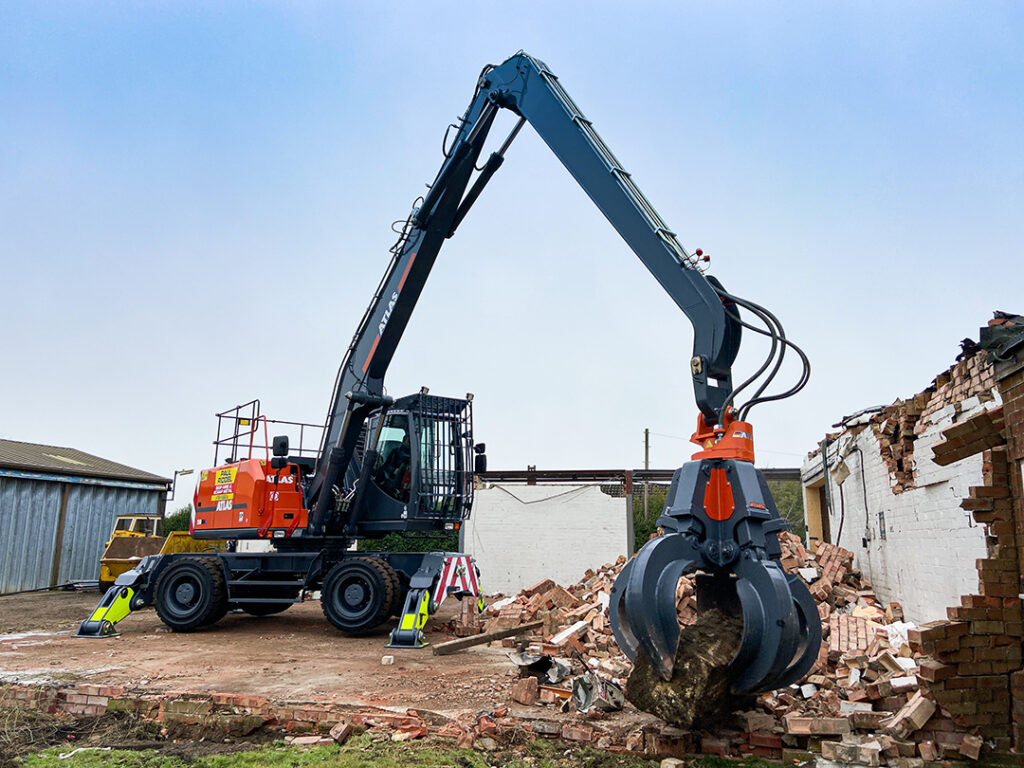 atlas 250mh material handler demolishing petrol station