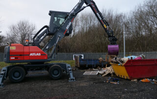 Atlas 200MH material handler with prodem grab