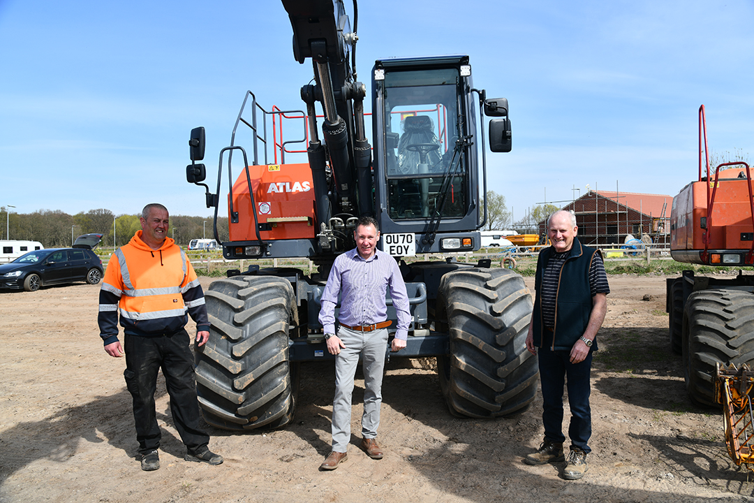 New Owners Richard and Dave Bichan anc TDL sales manager Gaz Bourner with new Atlas 140W bigfoot wheeled excavator